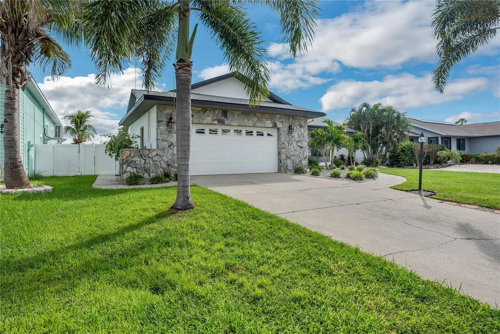 The A/C system is approximately 7 years old. Additional conveniences include a central vacuum system, water softener, and washer/dryer hookups in both the garage and indoor laundry room.