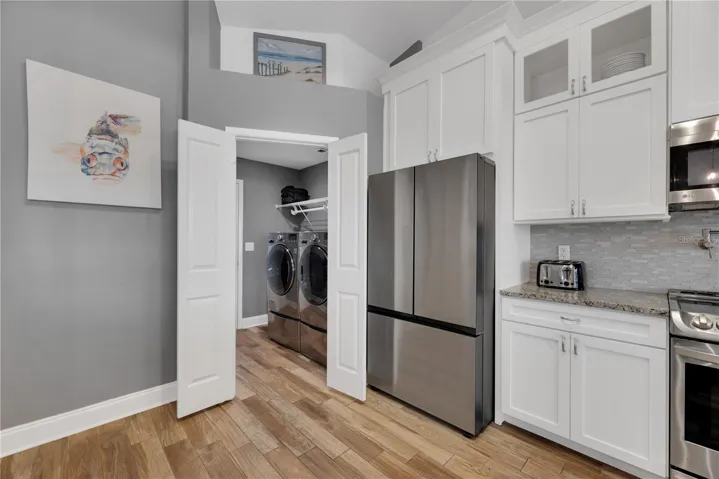 The double doors in the kitchen open to an inside laundry and garage access.