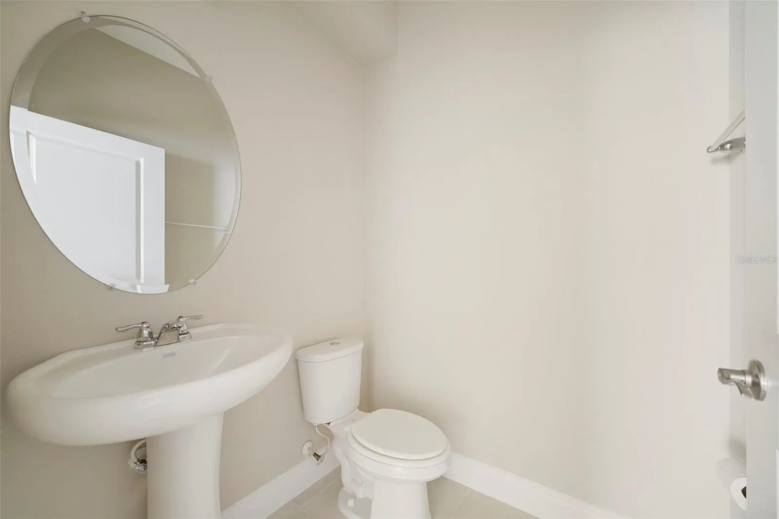 A nearby half bath is also conveniently located downstairs for guests.