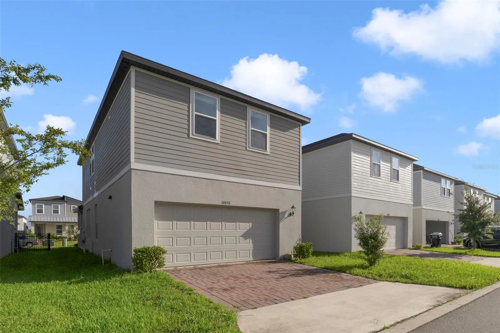 The home's rear-facing TWO-CAR GARAGE provides secure parking and storage while maintaining the attractive streetscape from the front of the home.