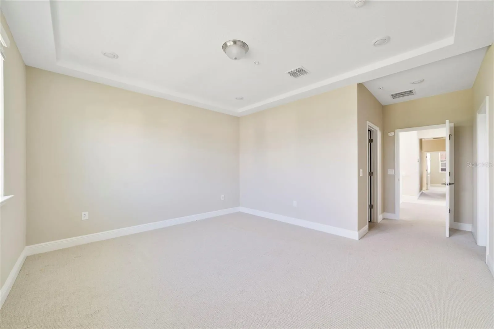 The spacious PRIMARY SUITE features a beautiful TRAY CEILING, a generous WALK-IN CLOSET and a private en-suite bath.