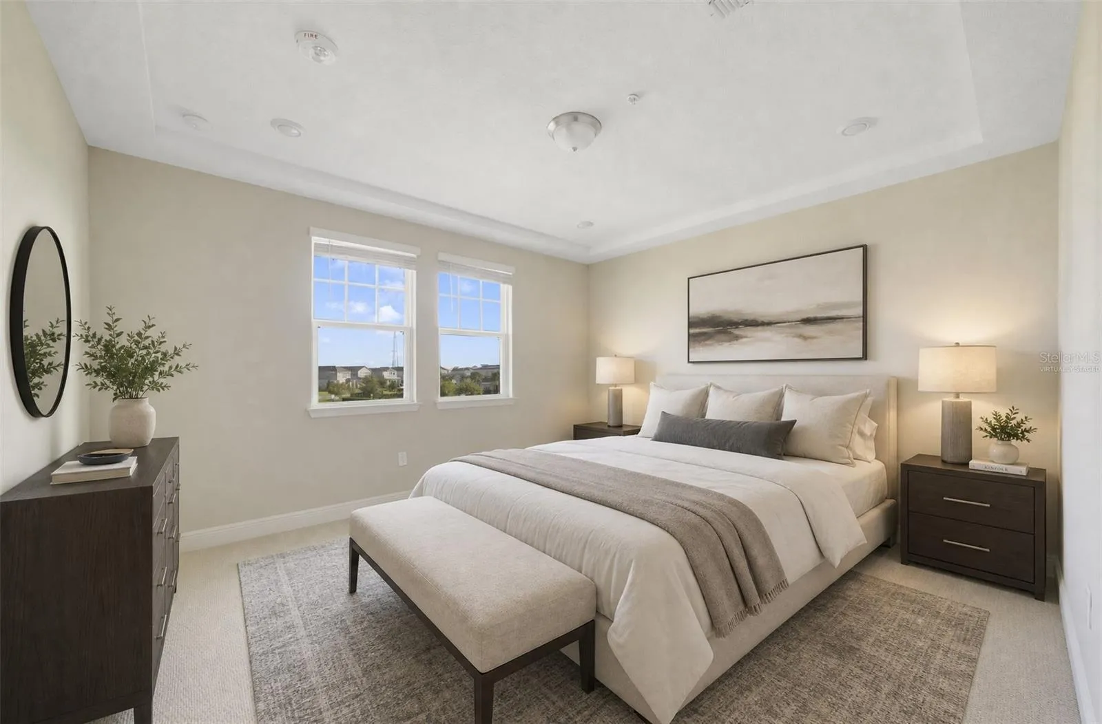 The spacious PRIMARY SUITE features a beautiful TRAY CEILING, a generous WALK-IN CLOSET and a private en-suite bath. Virtually Staged