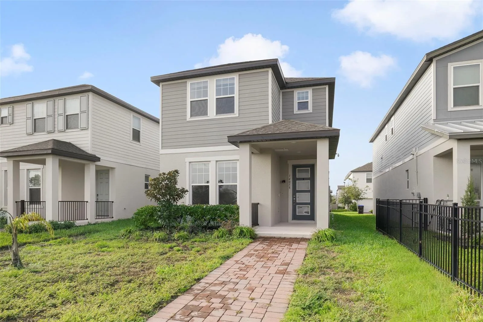 Built in 2023 and offering just under 2,000 SQUARE FEET of beautifully designed living space, this 4-BEDROOM, 2.5-BATH two-story home in Highland Ridge feels fresh, modern and MOVE-IN READY from the moment you arrive. A BRICK PAVER WALKWAY leads to the welcoming front porch and modern 4-LITE ENTRY DOOR.