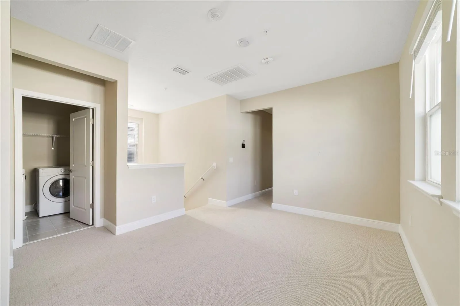 At the top of the stairs, the carpeted Loft creates an additional FLEXIBLE LIVING SPACE that could be used as a playroom, media area, homework zone or second gathering space.