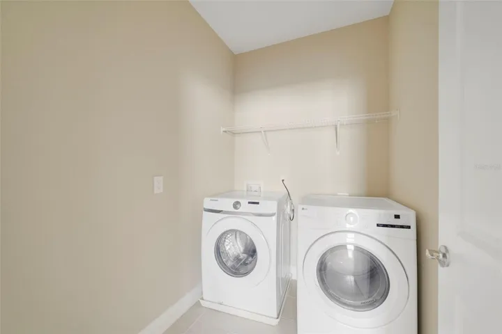 The UPSTAIRS LAUNDRY ROOM adds everyday convenience, with the WASHER AND DRYER INCLUDED.