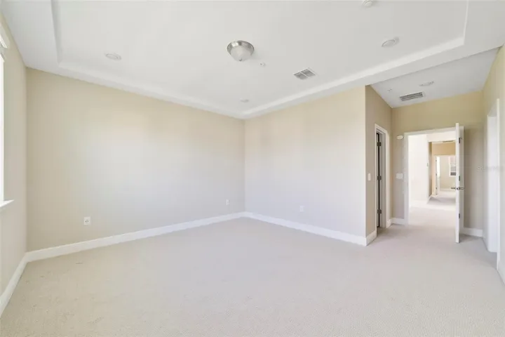 The spacious PRIMARY SUITE features a beautiful TRAY CEILING, a generous WALK-IN CLOSET and a private en-suite bath.