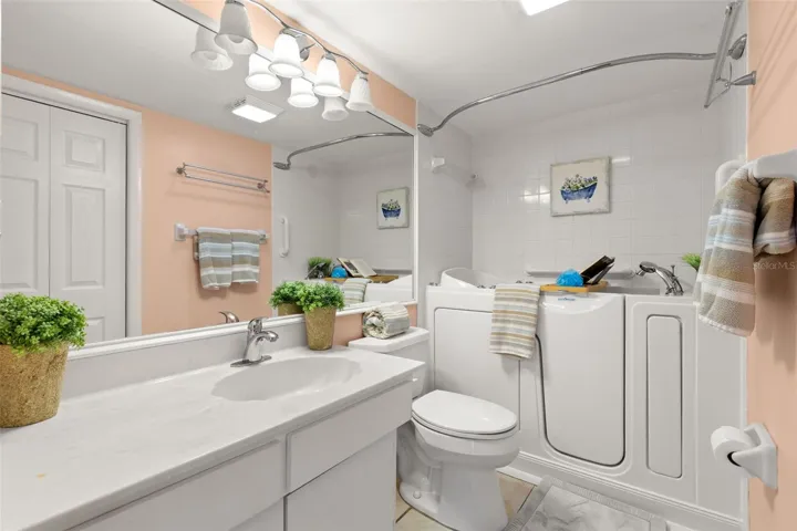 bedroom 2 bath with walk in tub/shower combo