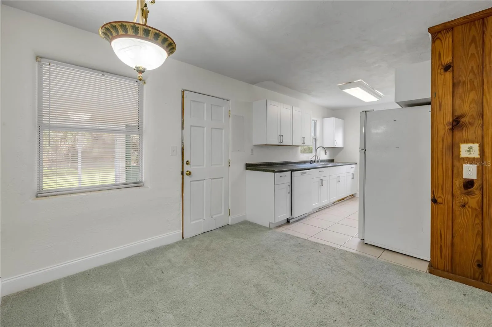 Front entry room looking AT kitchen area