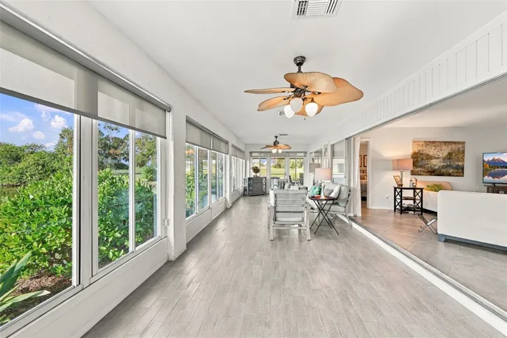 The lovely tile flooring makes for easy cleaning and with multiple fans, there is always a breeze.  Windows everywhere allow the outdoors to come right into your home.