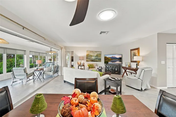 Multiple sliding glass doors offer a separation of space, if desired.