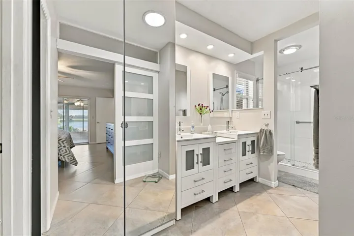 Stunning ensuite bathroom with dual sinks, updated shower and modern fistures.
