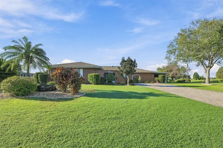This lot is almost 1/2 acres with custom curbing and easy maintenance plantings.