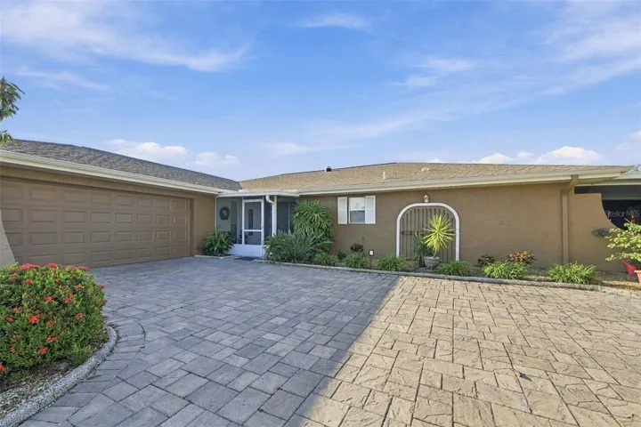 Oversized parking pad is perfect for multiple family members and guests.  Screened front porch is perfect for guests and packages to remain out of the weather.