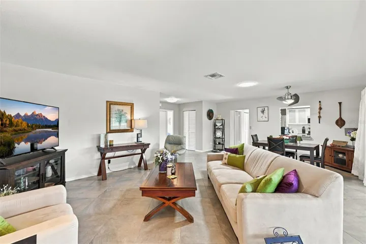 Notice the soft modern neutral tones throughout the home, along with solar tubes for extra natural light and modern ceiling fans.