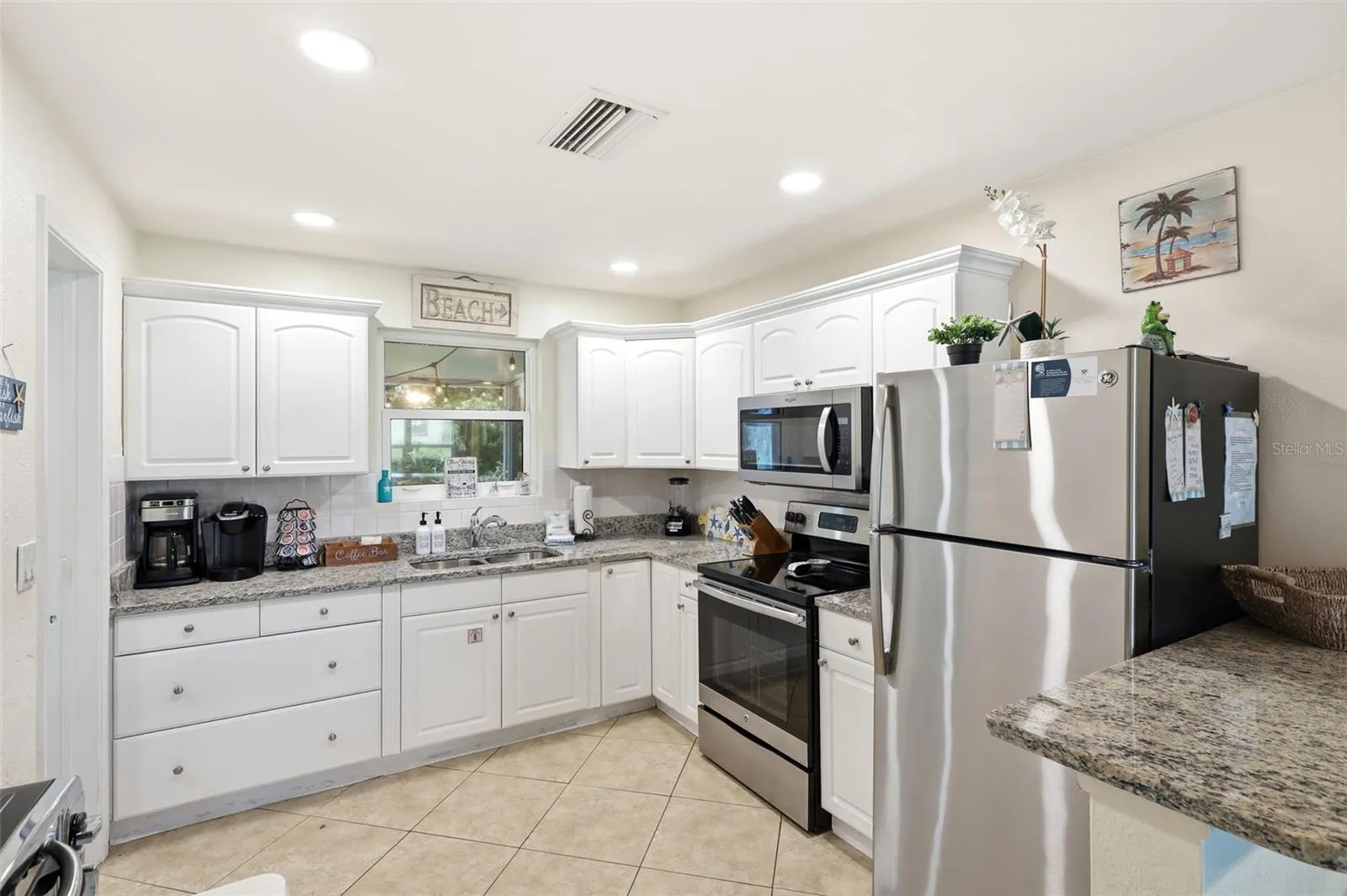 Kitchen. White cabinets, granite, and stainless appliances