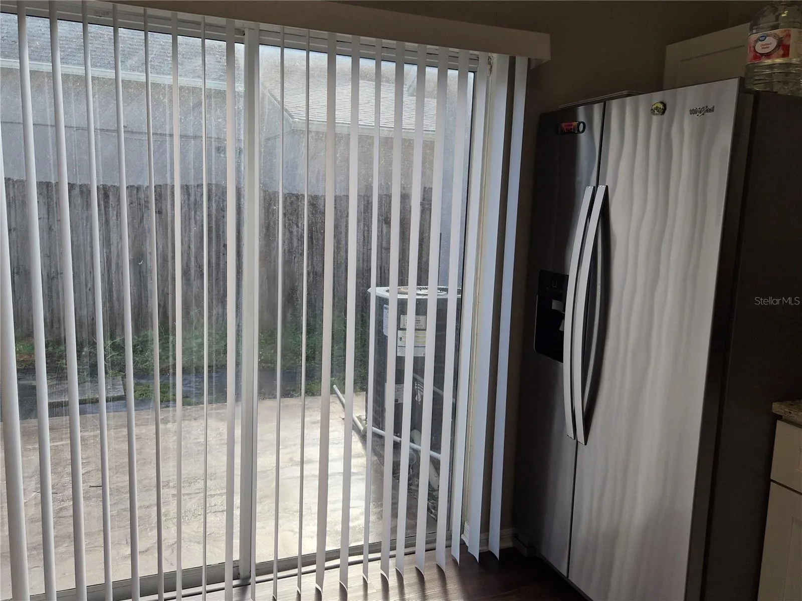 Exit sliding doors to the back yard, from the kitchen