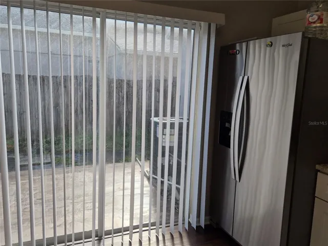 Exit sliding doors to the back yard, from the kitchen