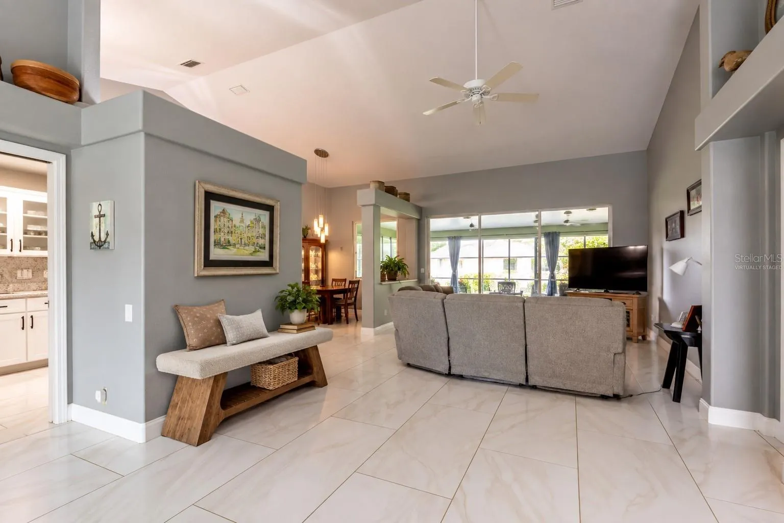 Virtually staged bench providing a convenient spot for guests to sit and place personal belongings.
