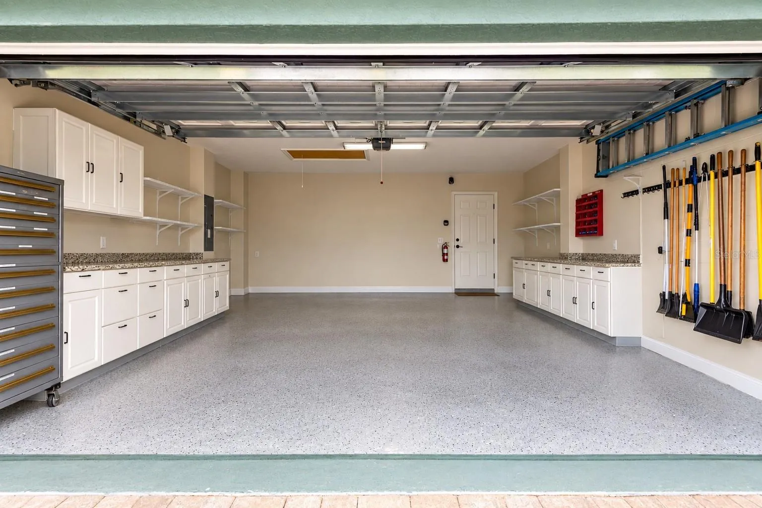 The cabinets and storage racks stay.