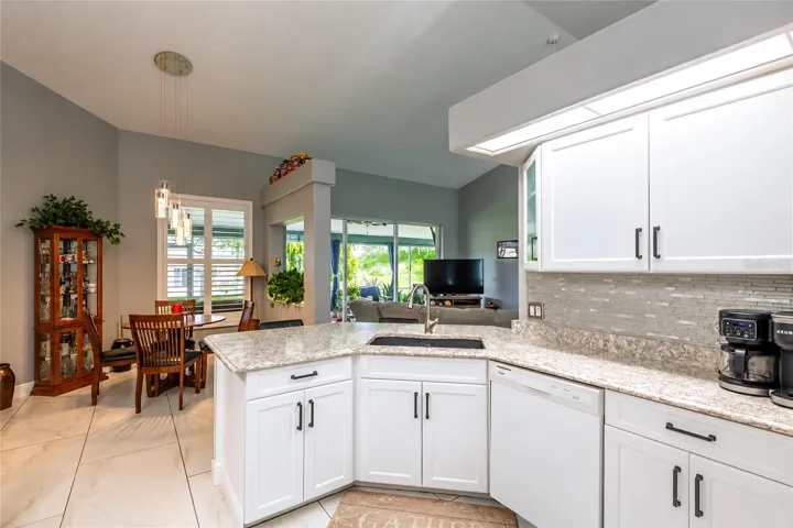 The kitchen is open to the dinette, great room and lanai.