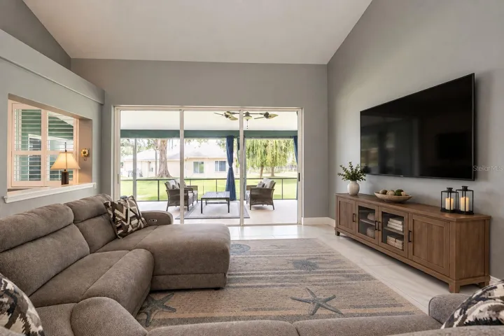 Virtually removed items from the lanai and great room and virtually added TV with cabinet.