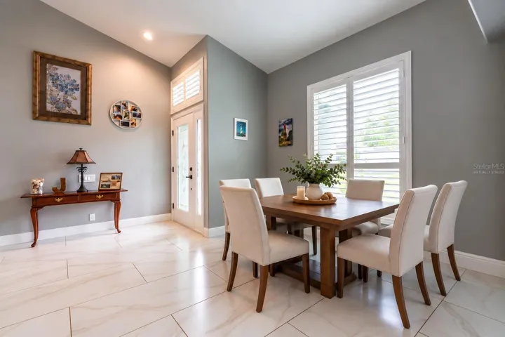 Enter into the foyer and the dining area is virtually staged.