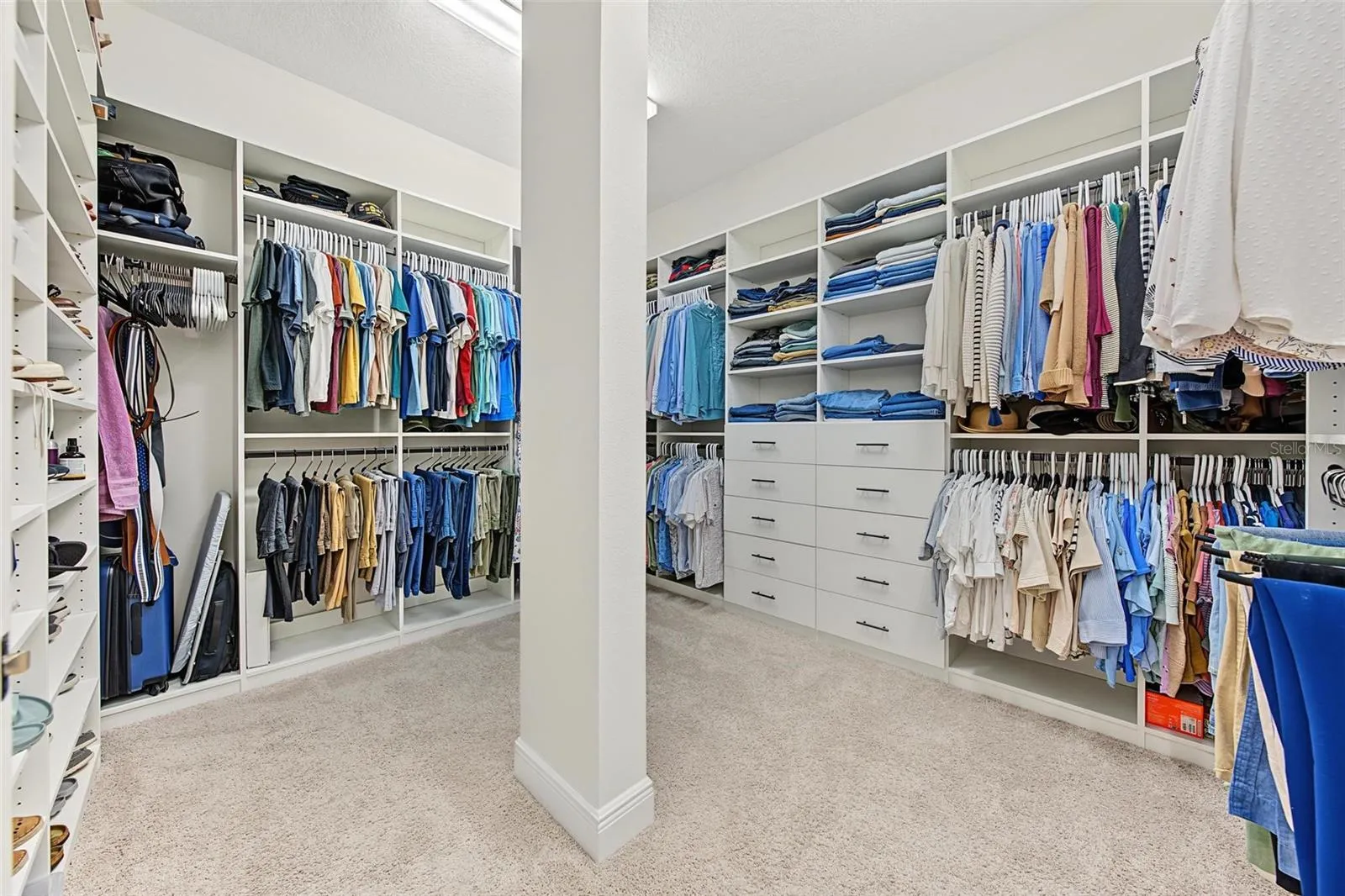 Custom, large, walk in closet with extensive built ins