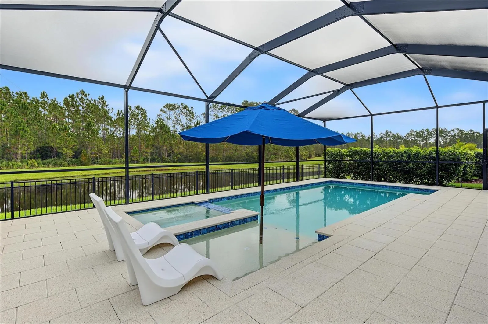 Relaxing view from pool with a sun shelf
