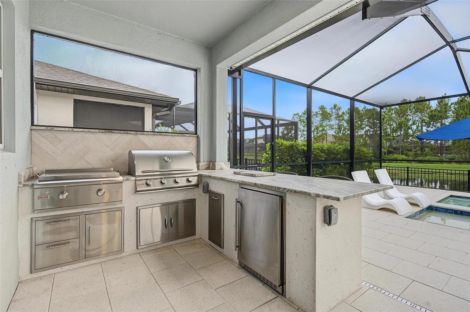 WOW! Outdoor kitchen is a huge plus!!