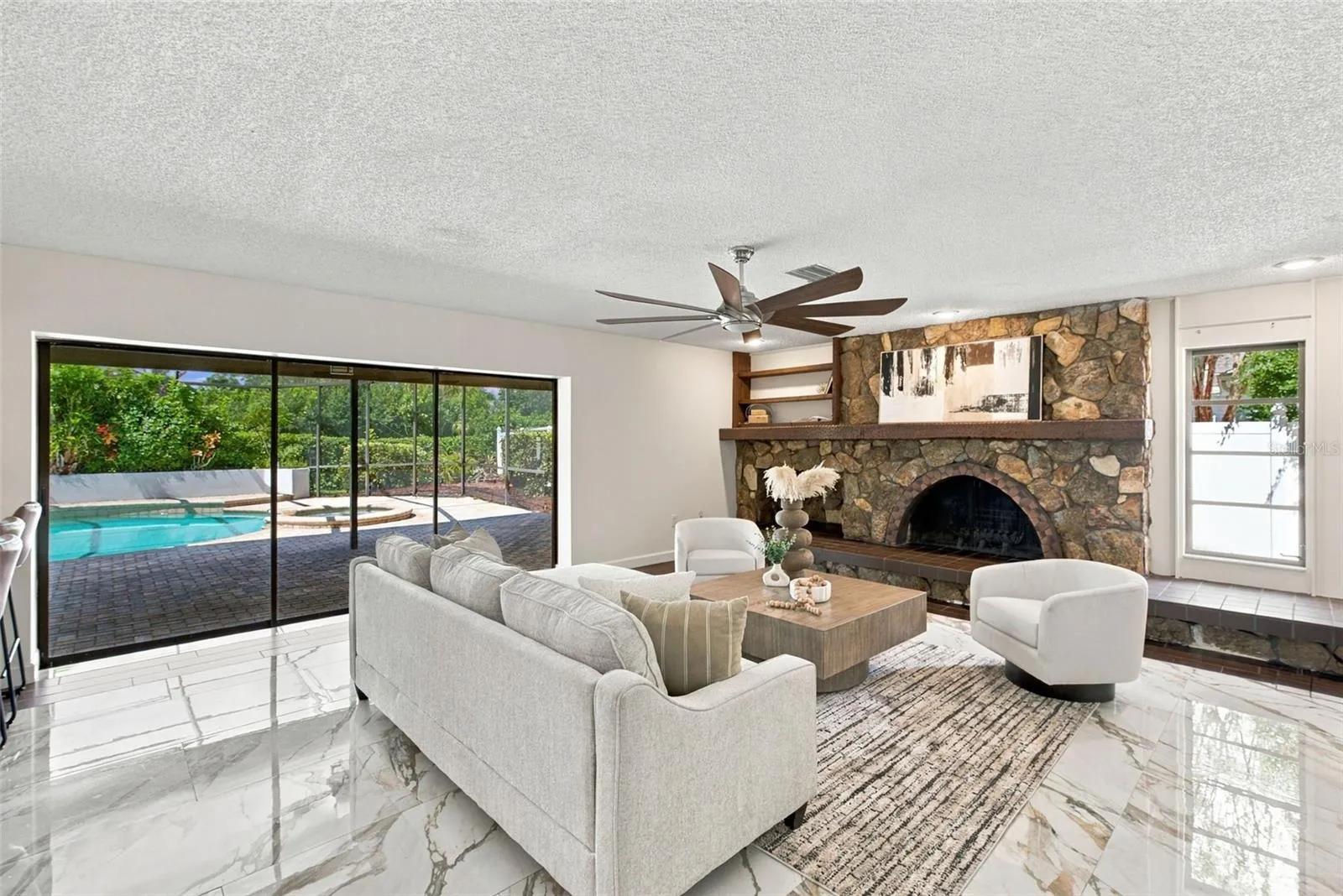 Living Room Sliders Fully Open to Enclosed Pool