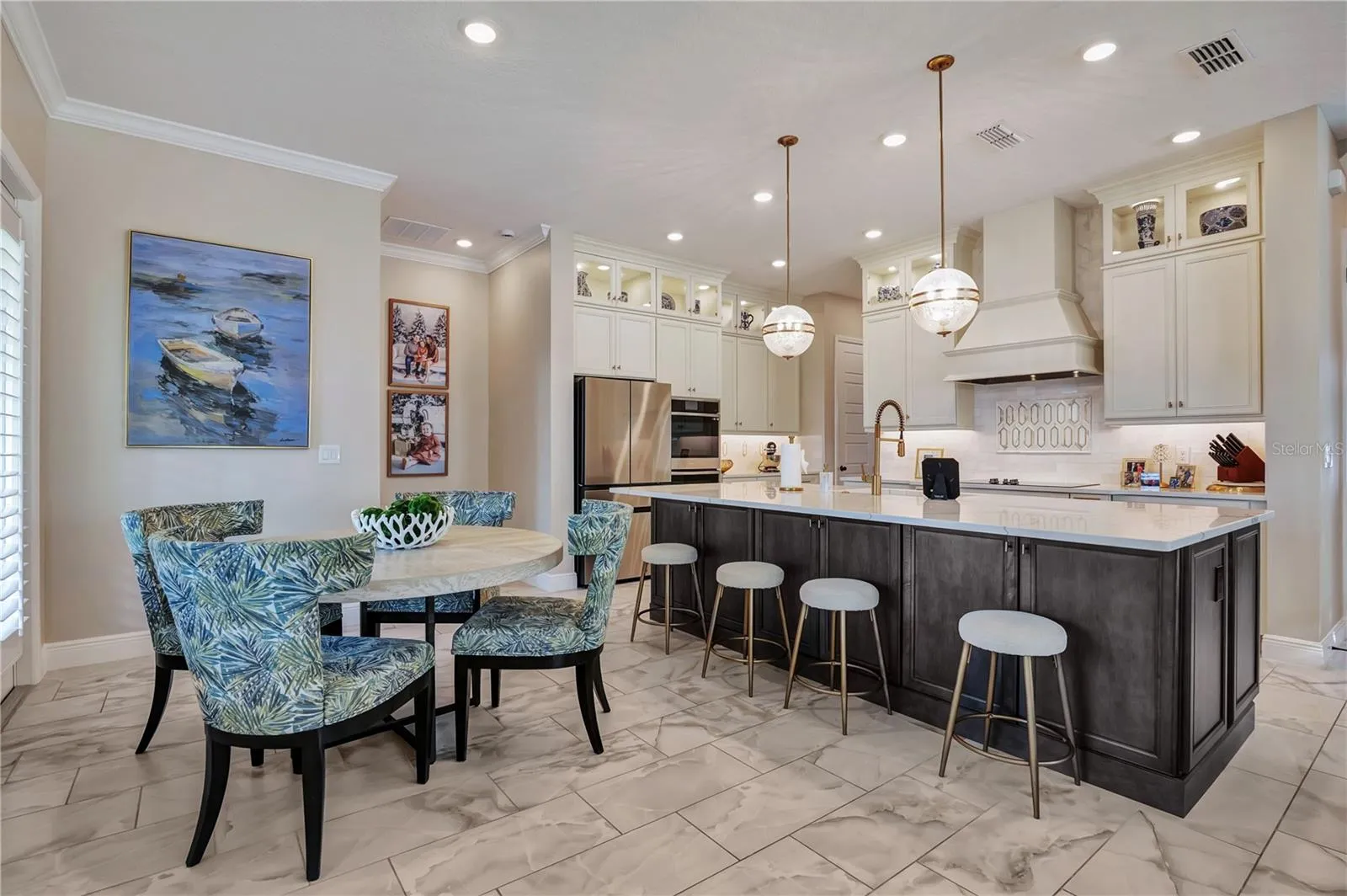 Breakfast nook and generous island seating provide multiple spaces for casual dining and gathering.