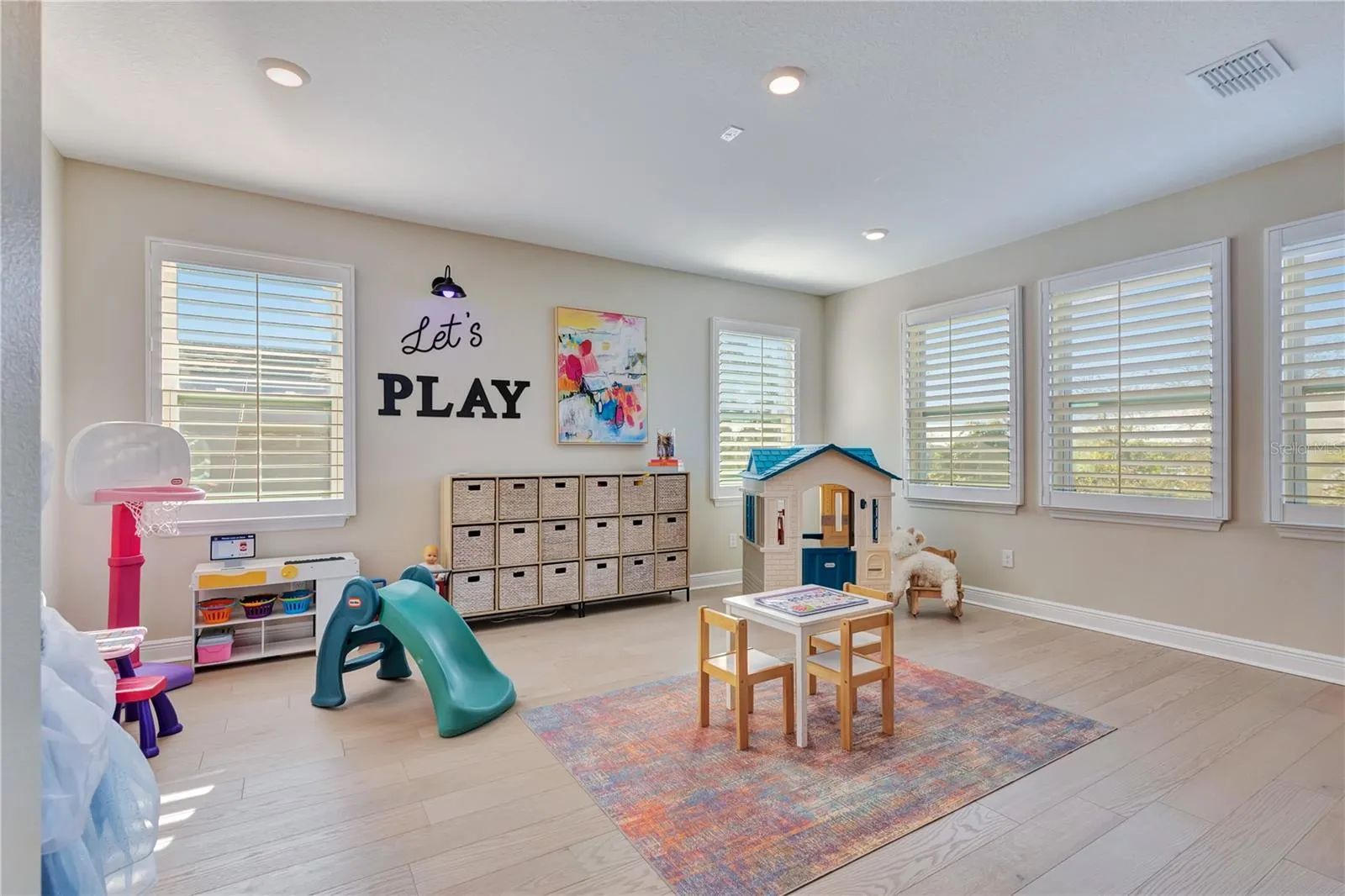 Bright play area within the upstairs loft offers flexible space for recreation, hobbies or study.