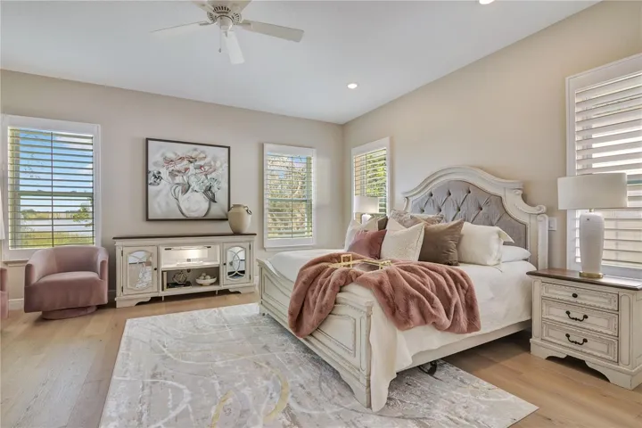 Beautifully appointed master with hardwood flooring, recessed lighting and a ceiling fan for added comfort.