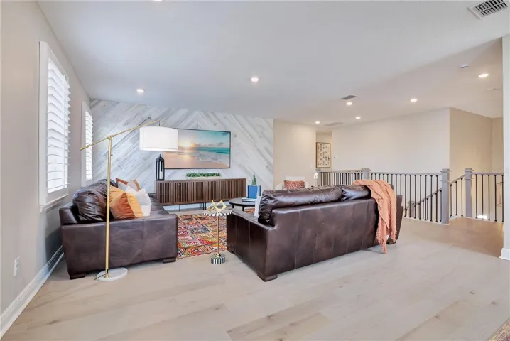 Upstairs gathering space offers generous room for comfortable seating and movie nights.
