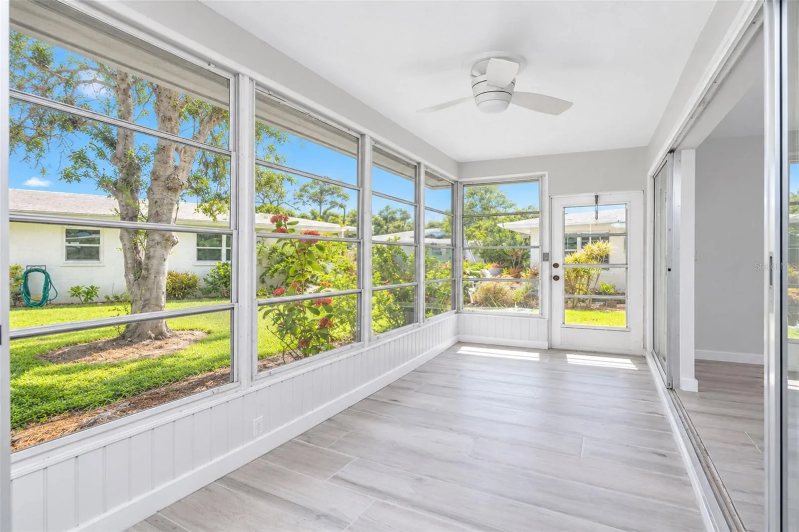 A door make you just steps away from the beautifully maintained back yard.