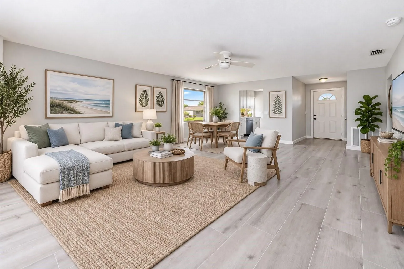 Open living and dining with lots of natural light.  (Virtually staged)