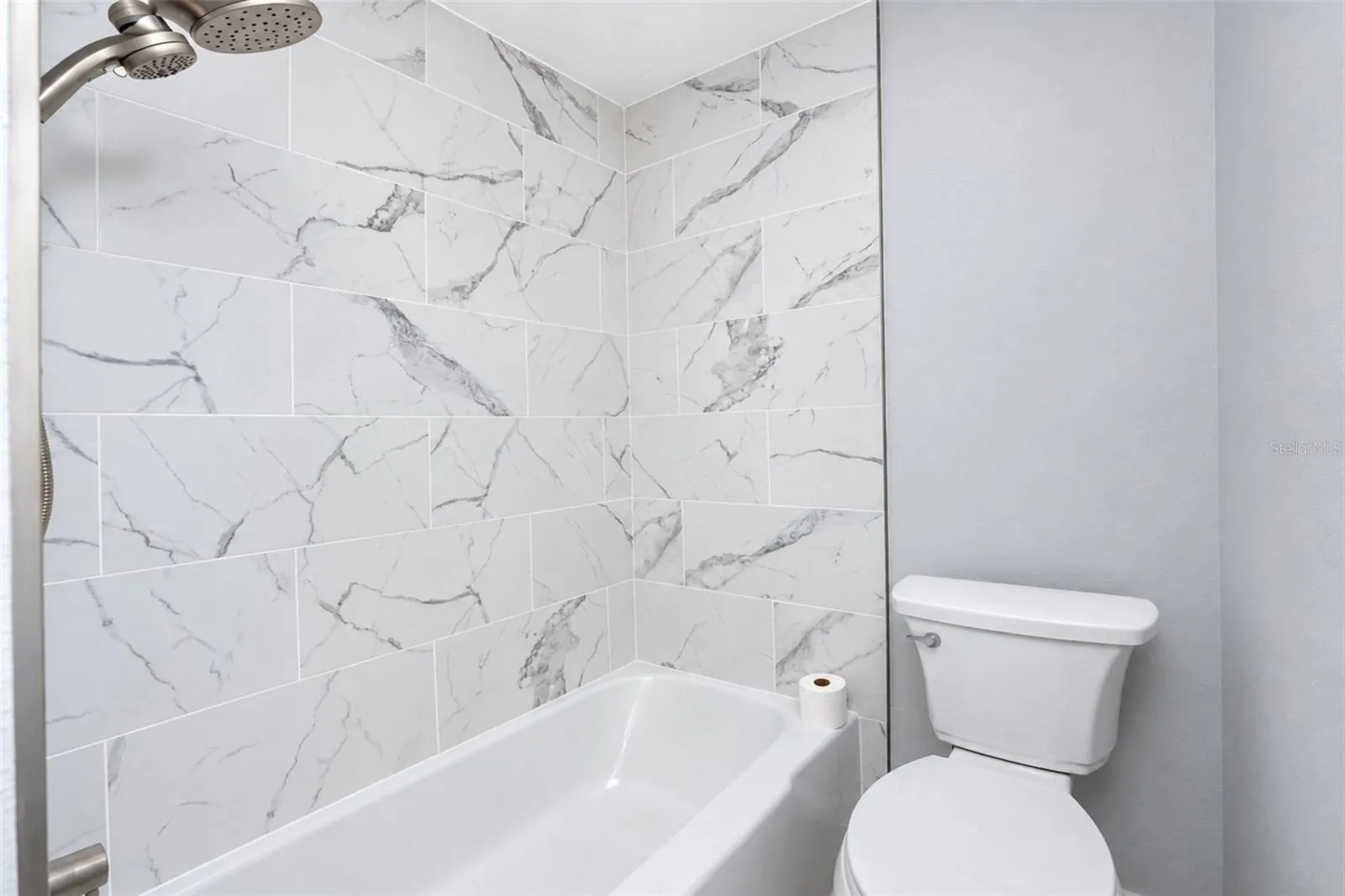 Marble inspired tile enclosure