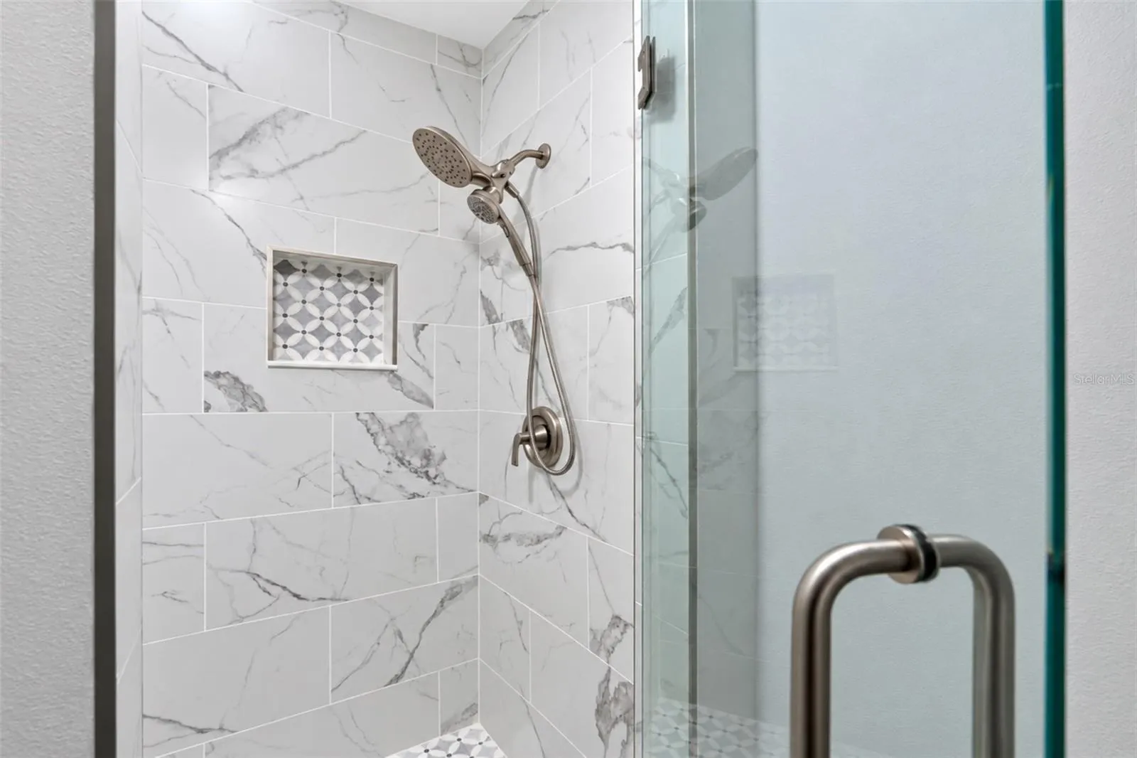 The Guest Bath offers a walk in shower with luxury glass enclosure.