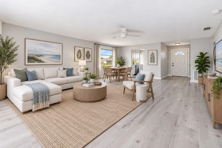 Open living and dining with lots of natural light.  (Virtually staged)