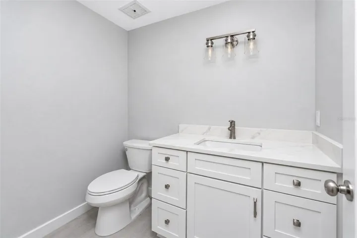 Guest Bath with new mission style cabinetry and quartz counters.