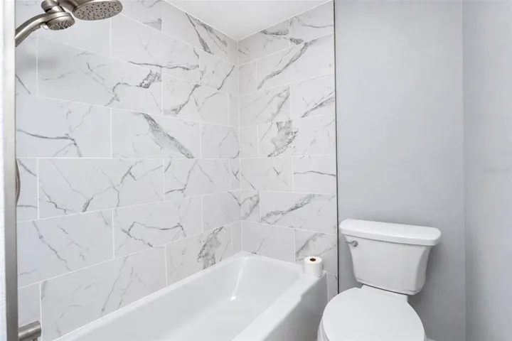 Marble inspired tile enclosure