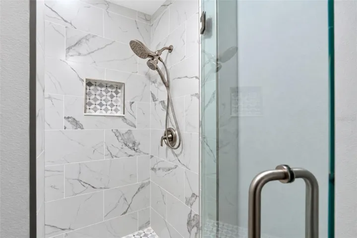 The Guest Bath offers a walk in shower with luxury glass enclosure.