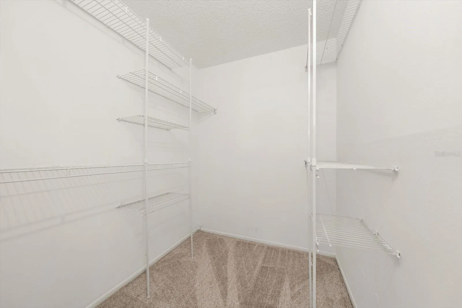 PRIMARY BEDROOM WALK-IN CLOSET