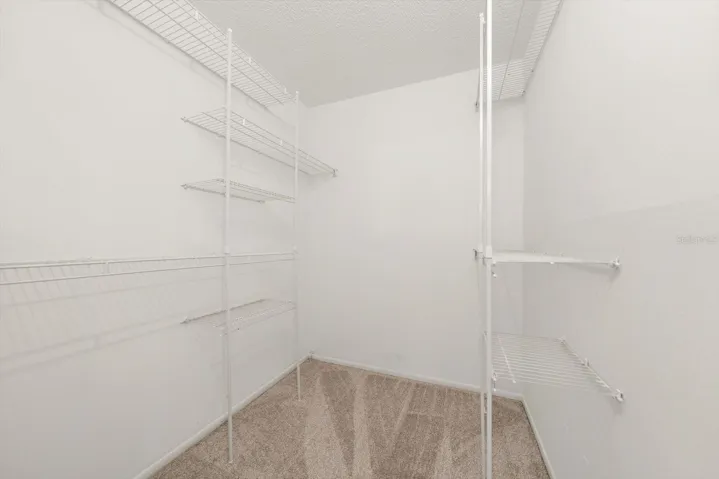 PRIMARY BEDROOM WALK-IN CLOSET