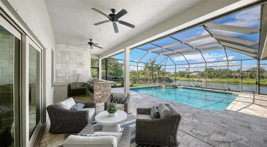 Lanai overlooking pool and wraparound pond