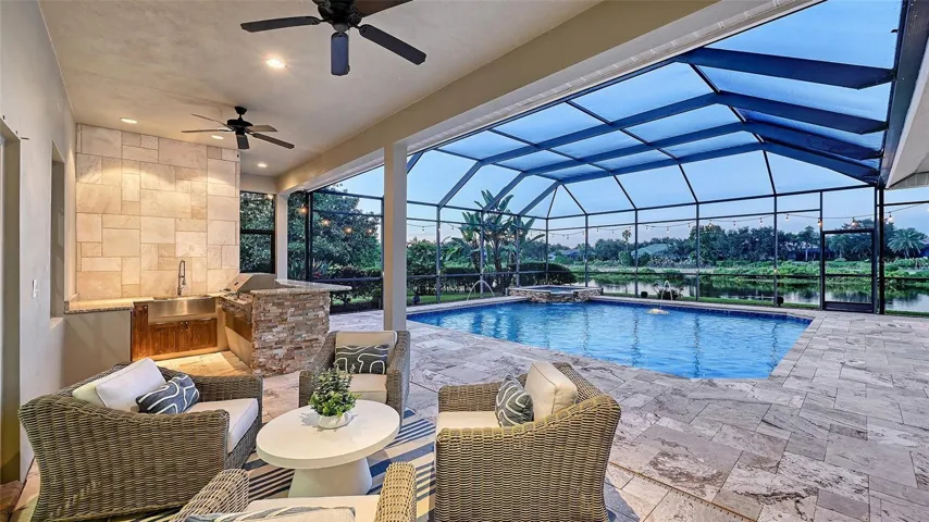 Lanai overlooking pool and wraparound pond