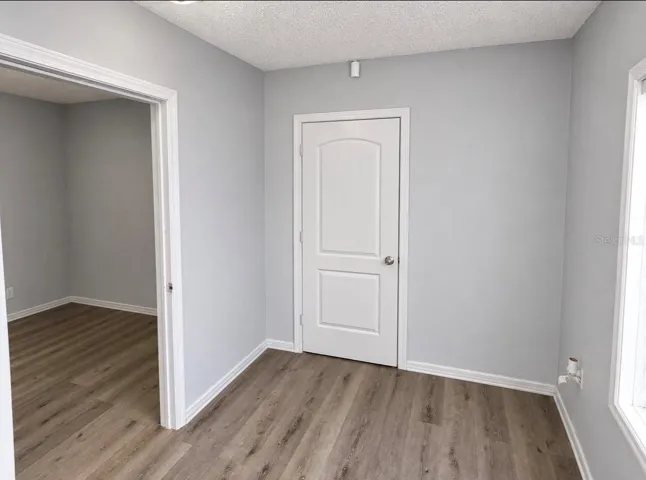 Foyer, open door to Office 2 and closed door to Office 3.