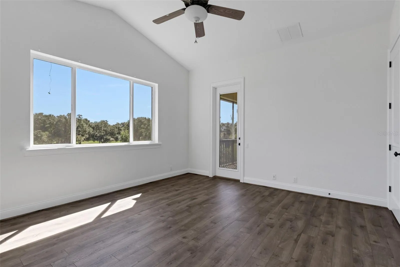 and also has a door that leads to the balcony area.