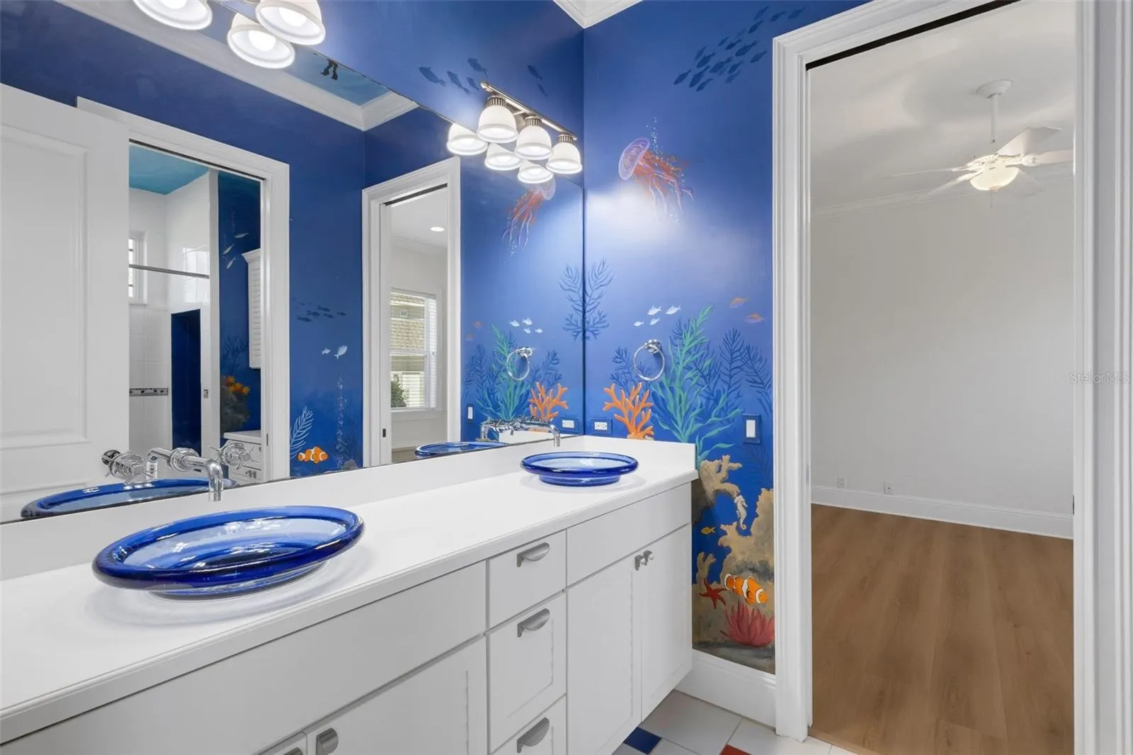 Bathroom# 2 has a custom painted mural that will make children WANT to take a bath.