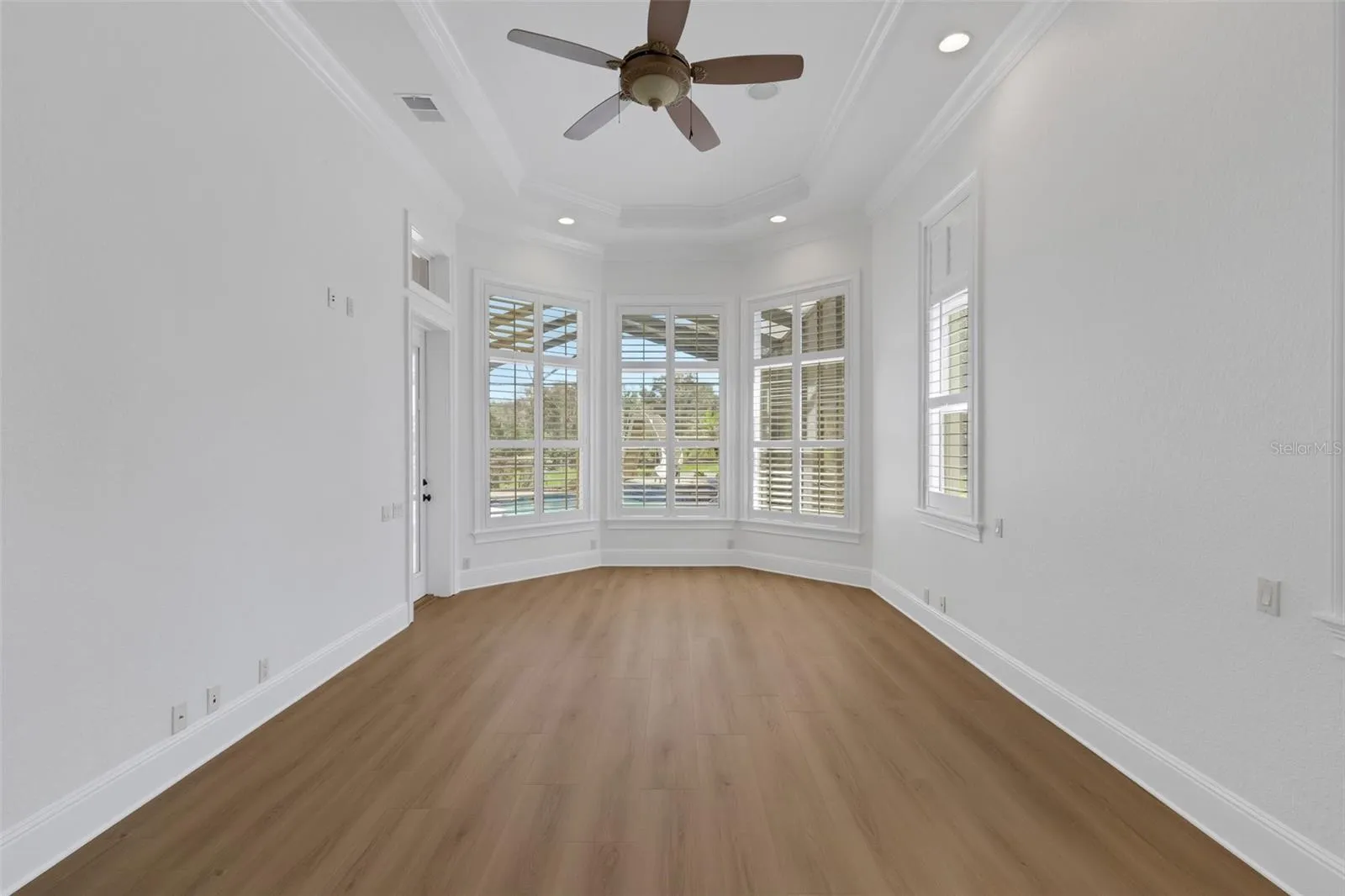 designed for a sitting area that overlooks the pool and backyard beyond.